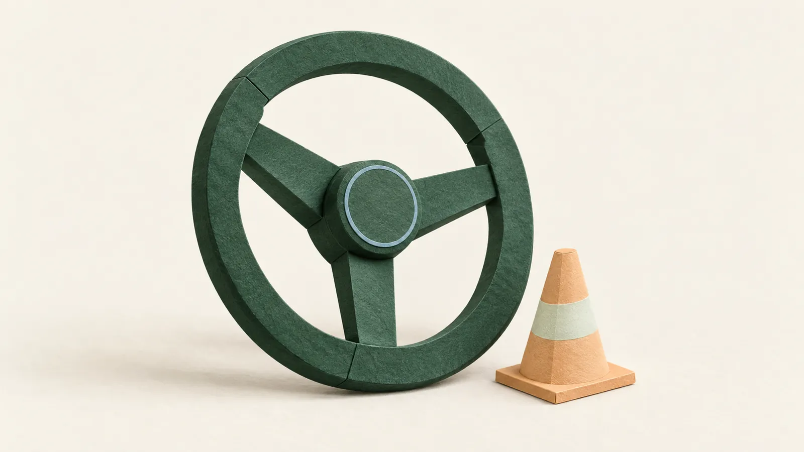 A forest-green paper steering wheel stands beside an apricot cone on warm ivory paper.