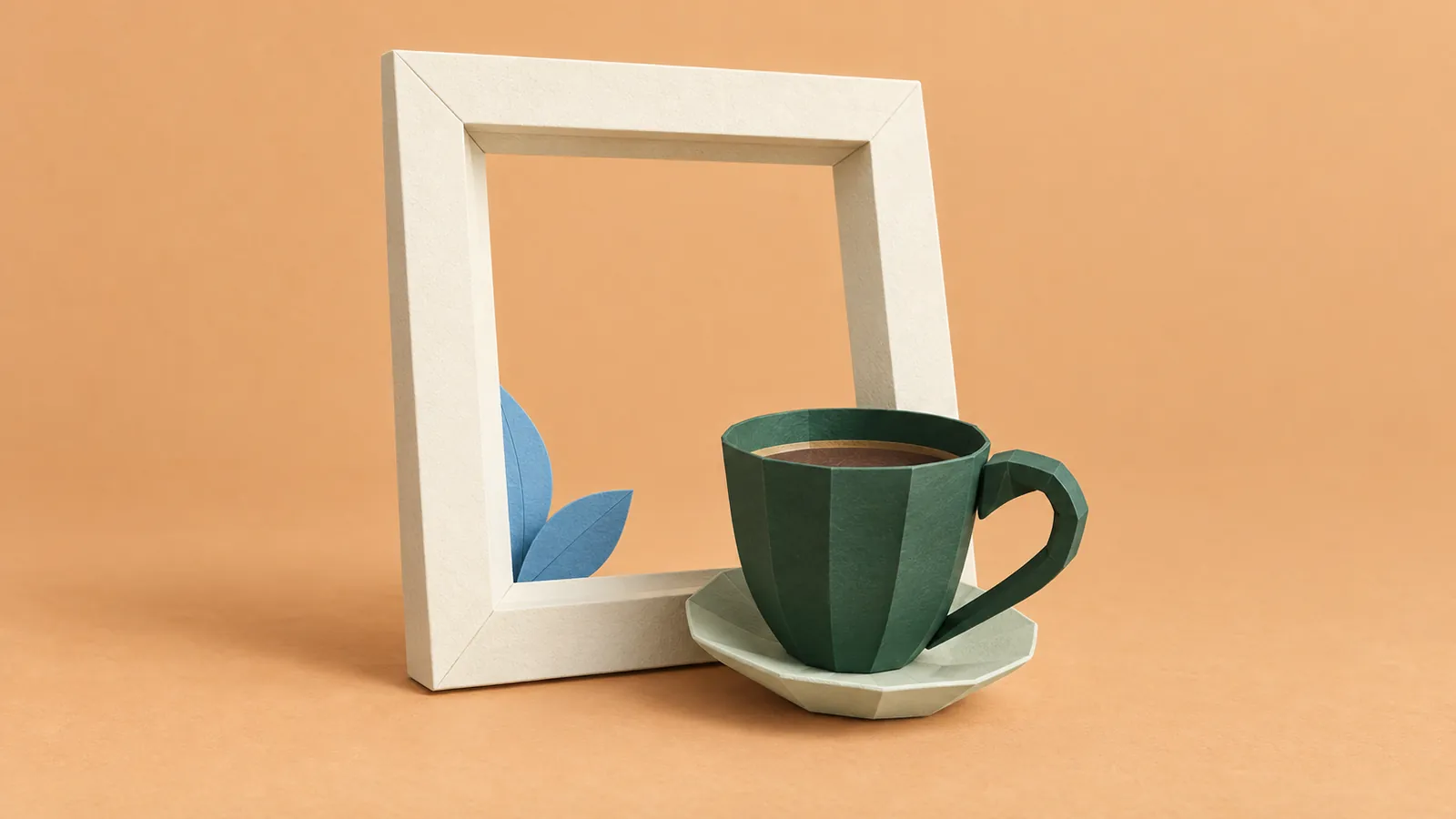 A forest-green paper coffee cup sits in front of an ivory picture frame on an apricot background.