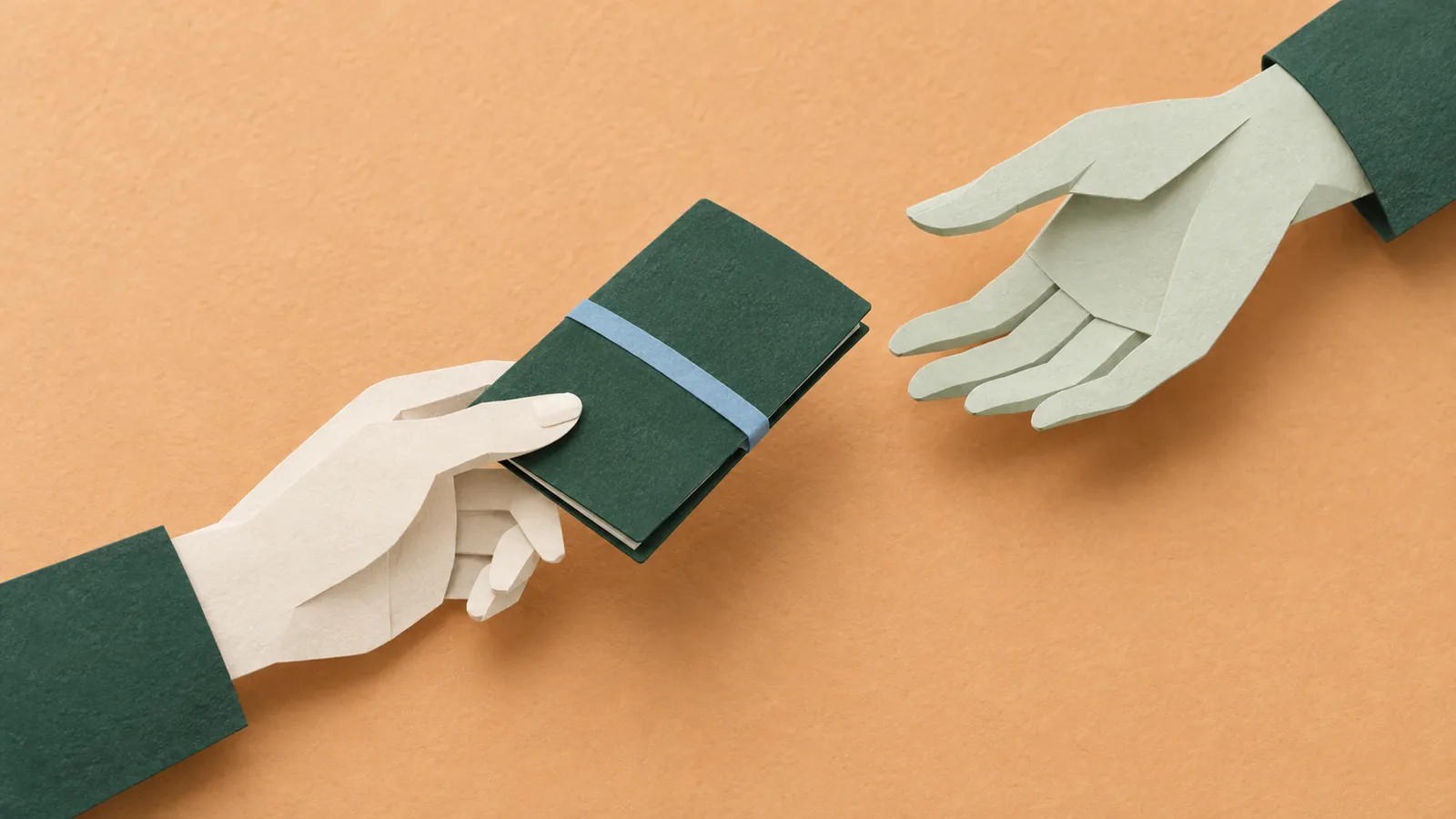 Two folded paper hands pass a forest-green booklet over warm apricot paper.